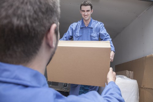 Removal team planning a house move on a Barnsbury street