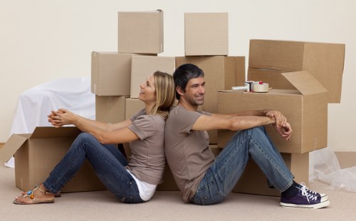 Trained van staff preparing furniture for secure transport