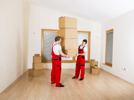 Professional movers handling household items in Barnsbury
