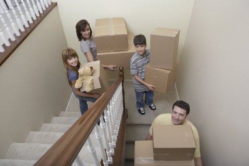 Unloading boxes and furniture at a new home in Barnsbury